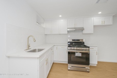 Fully gut-renovated 3 bedroom home in heart of 10309. Features a - photo 25