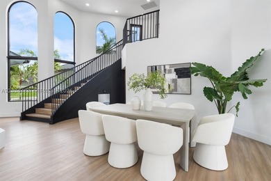 Located in Boca Grove, this charming remodel features a - photo 7