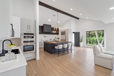 Located in Boca Grove, this charming remodel features a - photo 9