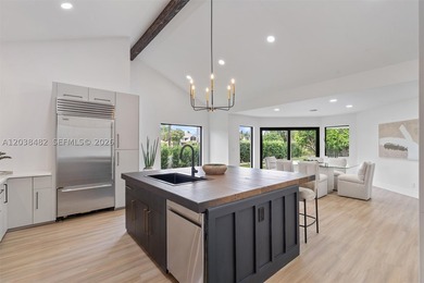 Located in Boca Grove, this charming remodel features a - photo 10