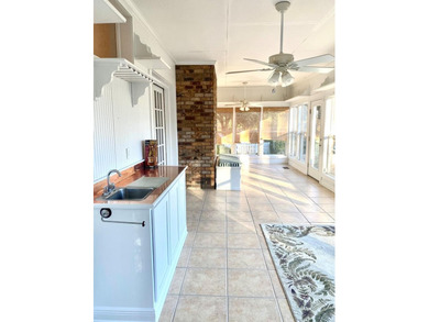 This beautiful home has it all! There is a sunroom with wet bar - photo 32