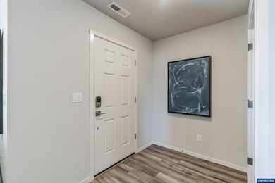 This well-designed two-story home offers an open and inviting