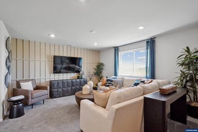 This well-designed two-story home offers an open and inviting