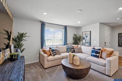 This well-designed two-story home offers an open and inviting