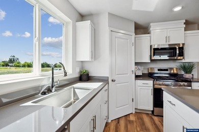 This well-designed two-story home offers an open and inviting