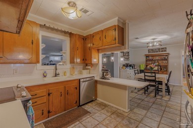 Welcome home to 902 N 75th Avenue, a charming property that - photo 12