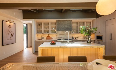 Tucked behind gates in prime Encino, this warm organic-modern - photo 13