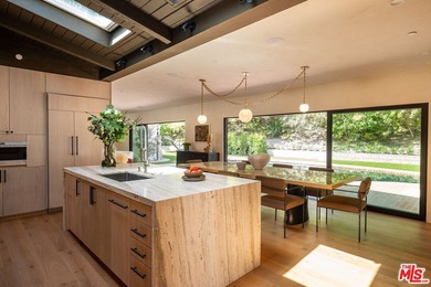 Tucked behind gates in prime Encino, this warm organic-modern - photo 15