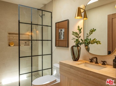 Tucked behind gates in prime Encino, this warm organic-modern - photo 22