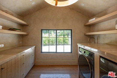 Tucked behind gates in prime Encino, this warm organic-modern - photo 28