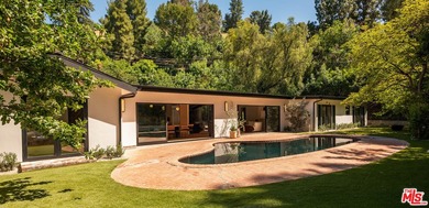 Tucked behind gates in prime Encino, this warm organic-modern - photo 29