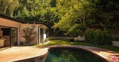 Tucked behind gates in prime Encino, this warm organic-modern - photo 30