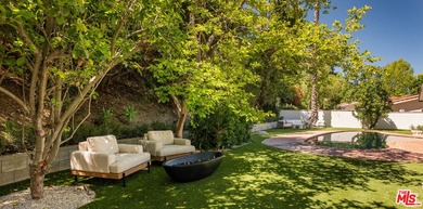 Tucked behind gates in prime Encino, this warm organic-modern - photo 31