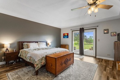Set back on 5.38 waterfront acres in Mahomet, this custom-built - photo 33
