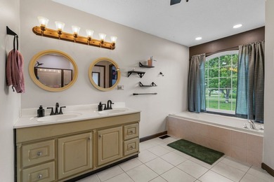Set back on 5.38 waterfront acres in Mahomet, this custom-built - photo 35