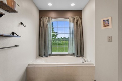 Set back on 5.38 waterfront acres in Mahomet, this custom-built - photo 36