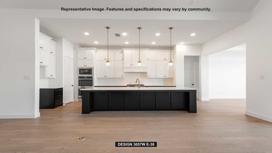 Entryway opens into the large family room which boasts a wood - photo 3