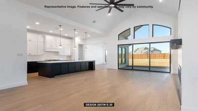 Entryway opens into the large family room which boasts a wood - photo 4