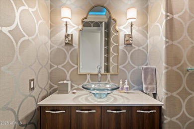 Tucked within the secluded Guard Gated Biltmore Hillside