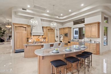 Tucked within the secluded Guard Gated Biltmore Hillside