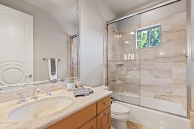 Tucked within the secluded Guard Gated Biltmore Hillside