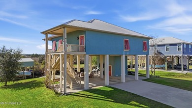 This beautifully maintained elevated waterfront home located in