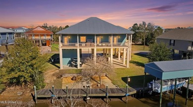 This beautifully maintained elevated waterfront home located in