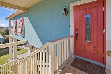 This beautifully maintained elevated waterfront home located in