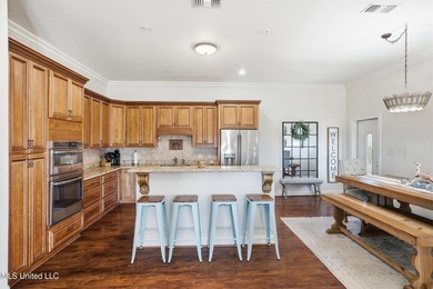 This beautifully maintained elevated waterfront home located in