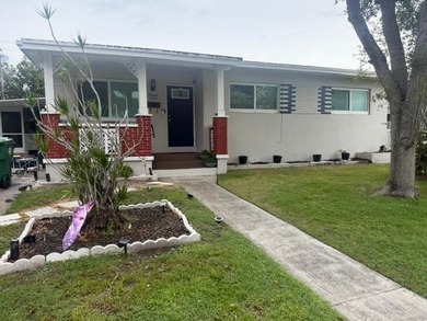 Welcome to this charming single-story residence located in Miami - photo 1