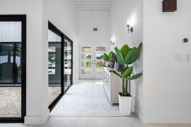 Set on one of the neighborhood's most impressive lots, this - photo 5