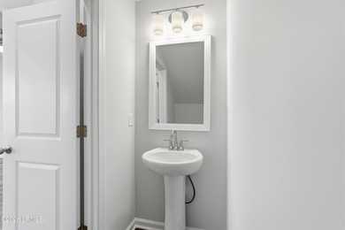 This two-story home includes three bedrooms and two-and-one-half - photo 13