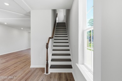 This two-story home includes three bedrooms and two-and-one-half - photo 14