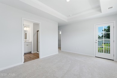 This two-story home includes three bedrooms and two-and-one-half - photo 16