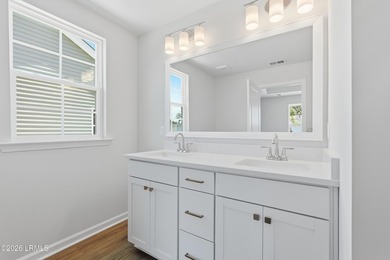 This two-story home includes three bedrooms and two-and-one-half - photo 17