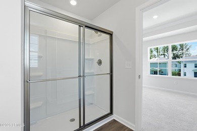 This two-story home includes three bedrooms and two-and-one-half - photo 18