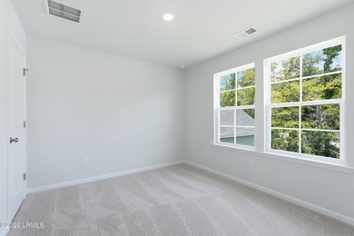 This two-story home includes three bedrooms and two-and-one-half - photo 20