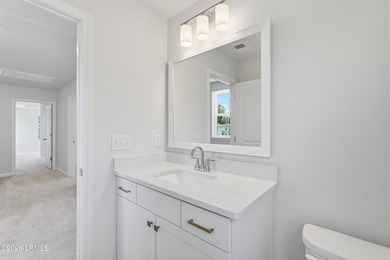 This two-story home includes three bedrooms and two-and-one-half - photo 21