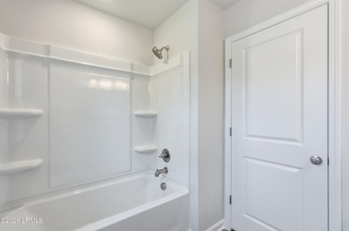 This two-story home includes three bedrooms and two-and-one-half - photo 22