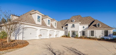 Poised along the water's edge in the prestigious Reunion Golf