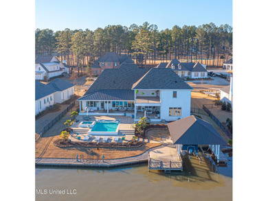 Poised along the water's edge in the prestigious Reunion Golf