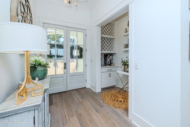 Poised along the water's edge in the prestigious Reunion Golf