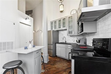 This rare, corner, ground-floor 2-bedroom, 2-bath unit in the