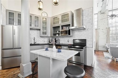 This rare, corner, ground-floor 2-bedroom, 2-bath unit in the