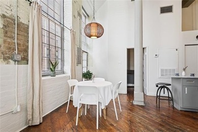 This rare, corner, ground-floor 2-bedroom, 2-bath unit in the