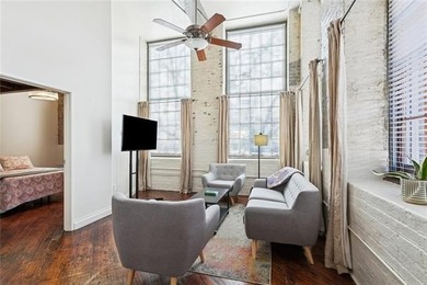 This rare, corner, ground-floor 2-bedroom, 2-bath unit in the