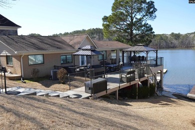 Remarkable waterfront home in a cove with lakefront views. - photo 11