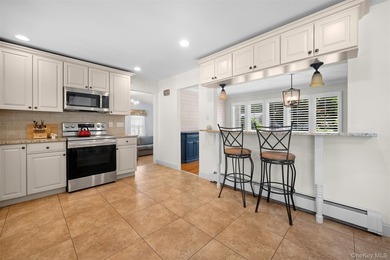 Welcome to this beautifully maintained 4-bedroom, 2-bath - photo 13