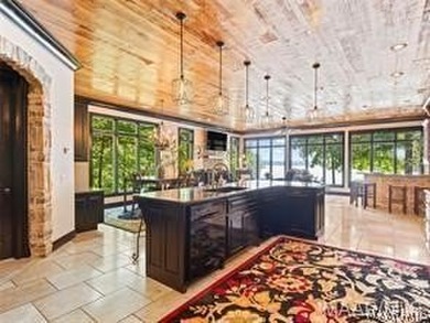 Experience elevated lakefront living on the pristine shores of - photo 16