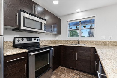 This two-story, townhouse-style condominium offers two primary - photo 13